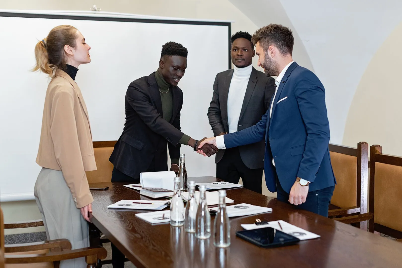 Corporate boardroom business acquisition handshake