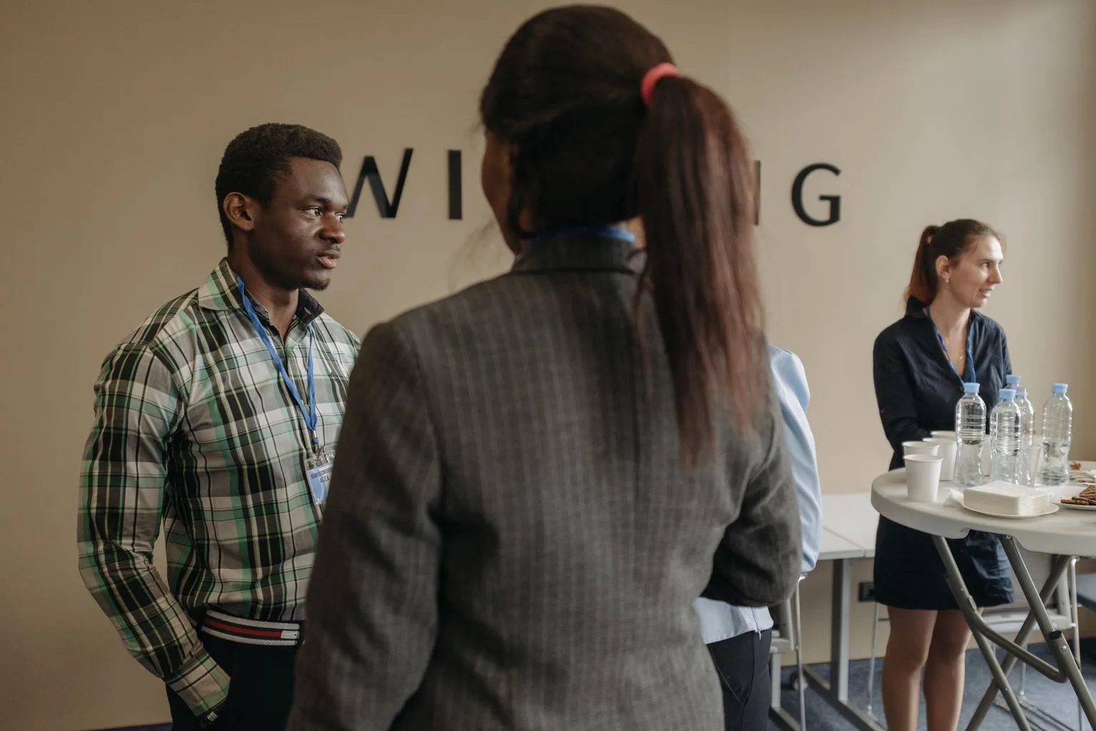 Business professionals networking at a franchise convention seminar