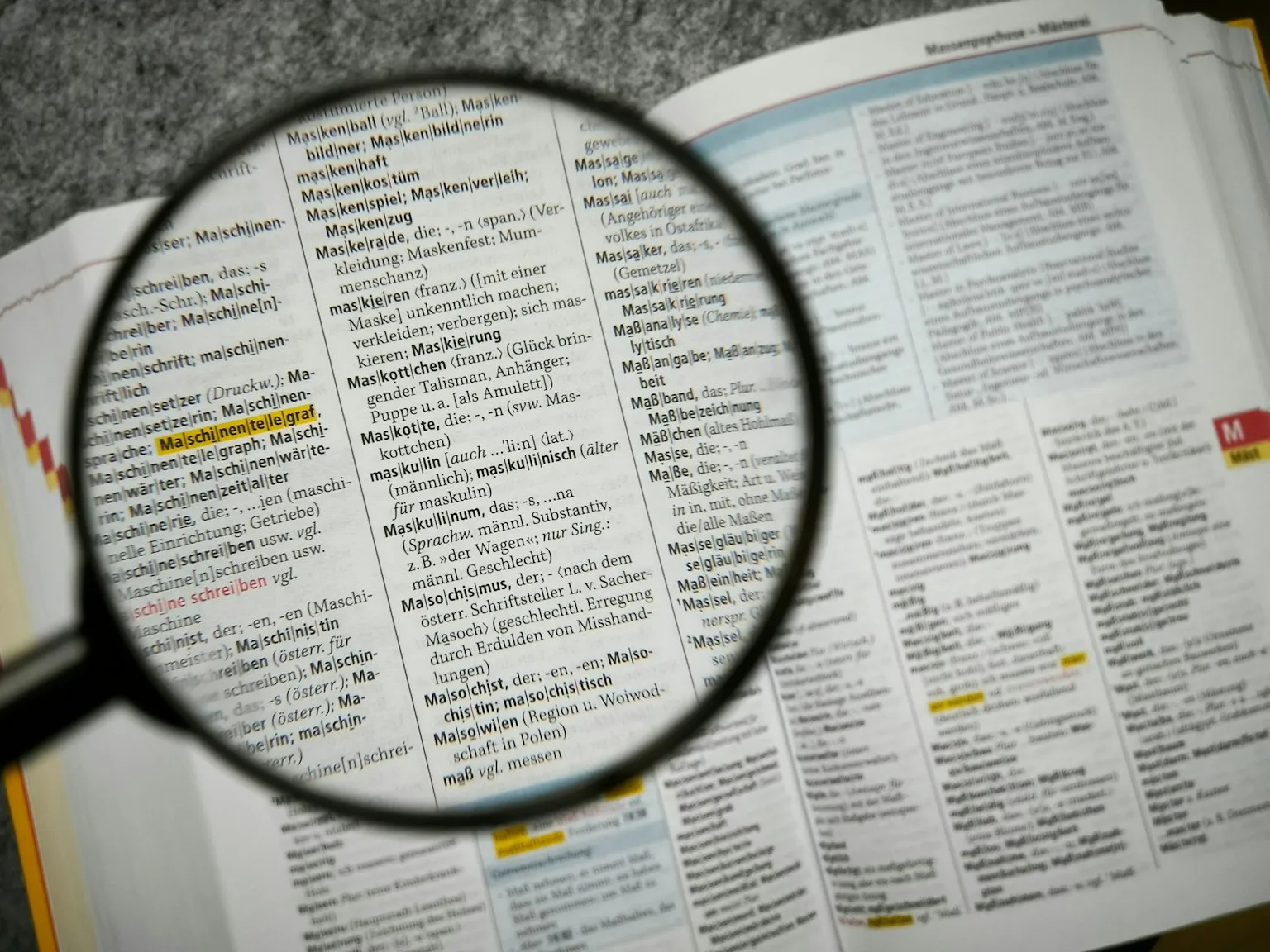Magnifying glass examining contract fine print and legal terms