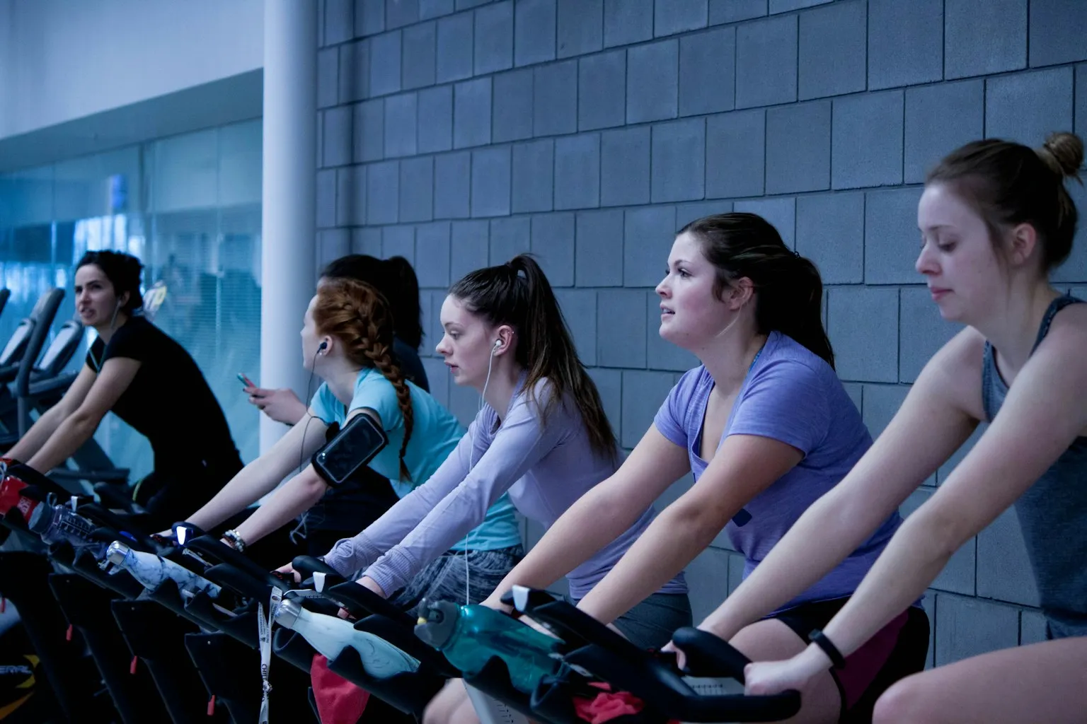 Empty indoor cycling studio with unused bikes — representing modality decline