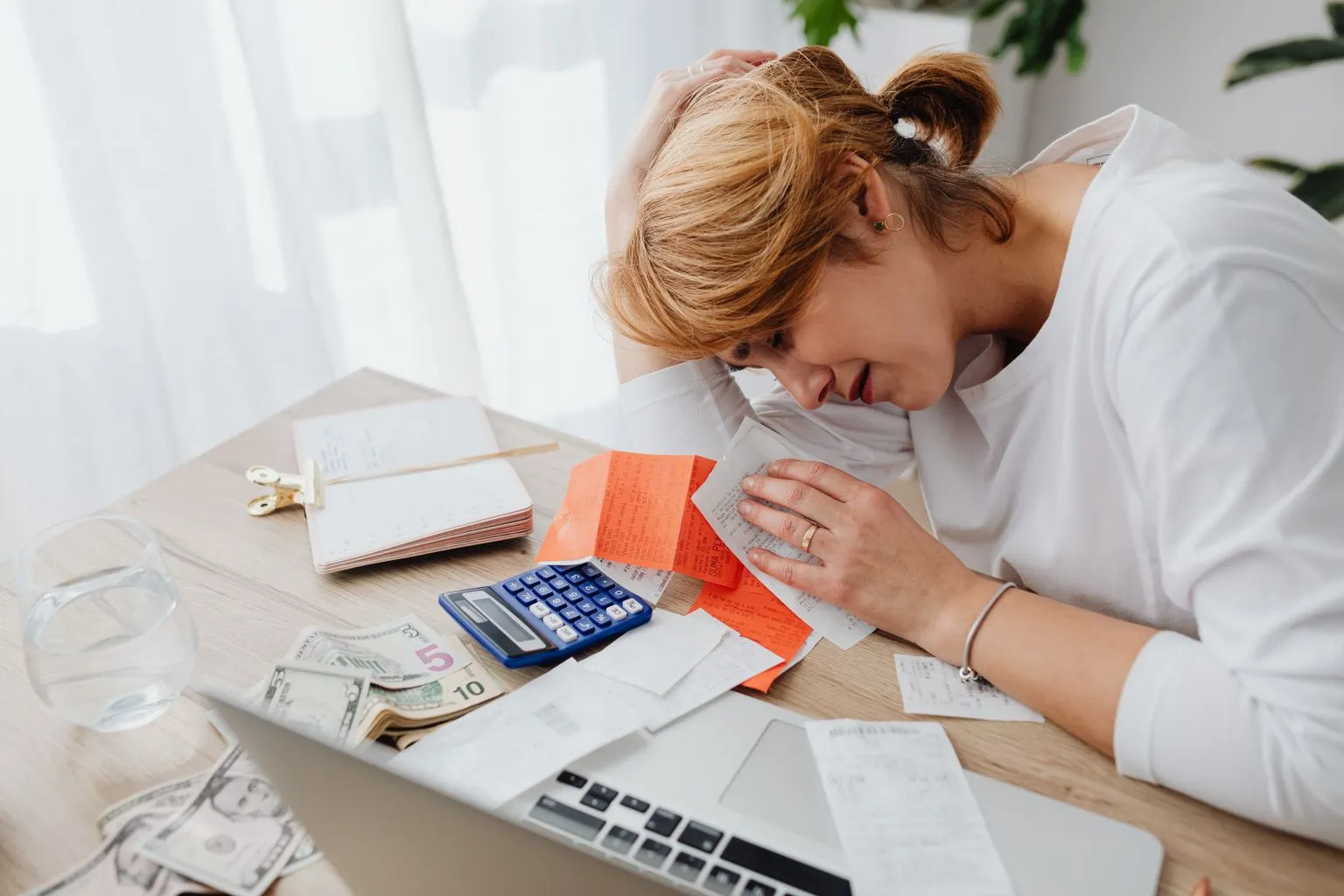 Business owner reviewing household budget and financial statements after franchise transition