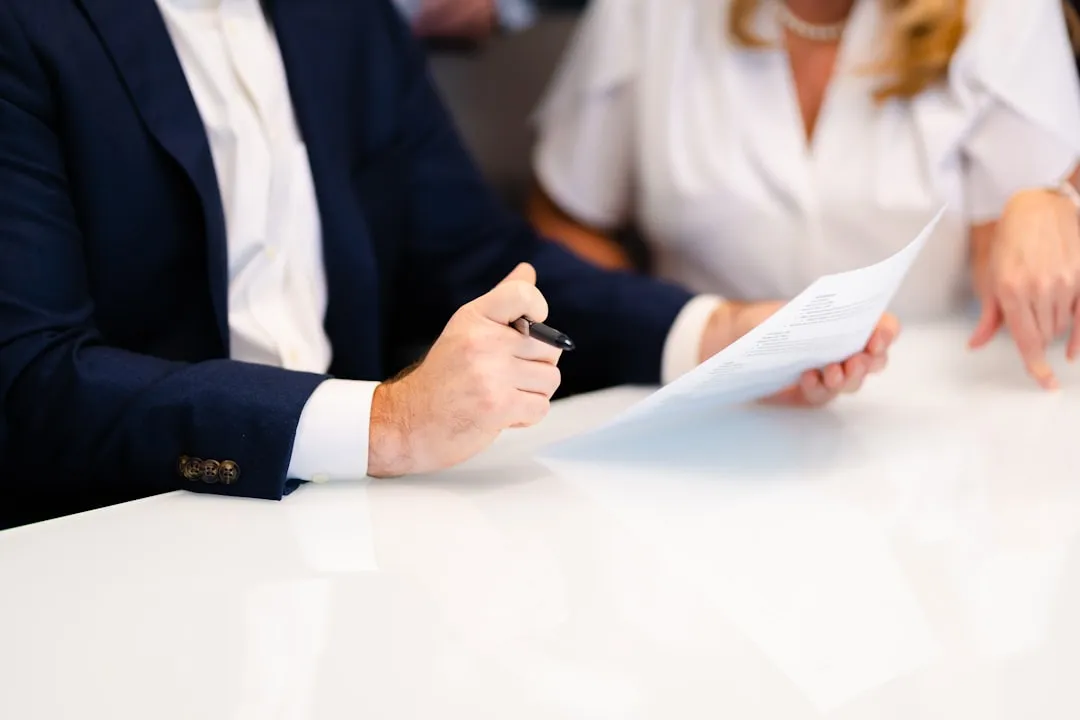 Business meeting with a lender reviewing franchise financing documents