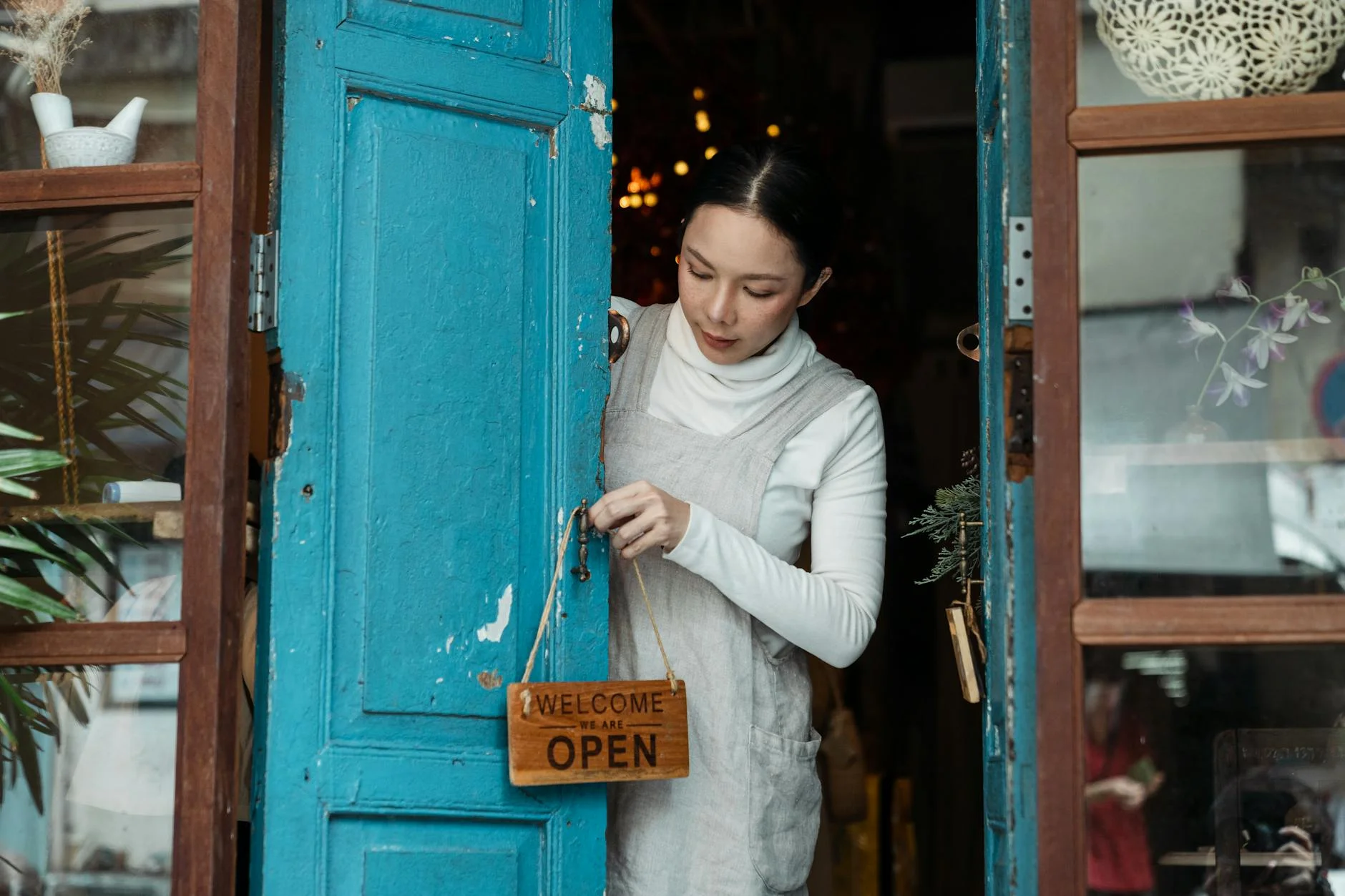 Business owner opening doors on grand opening day