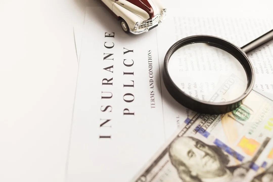 Insurance policy documents being reviewed on a desk