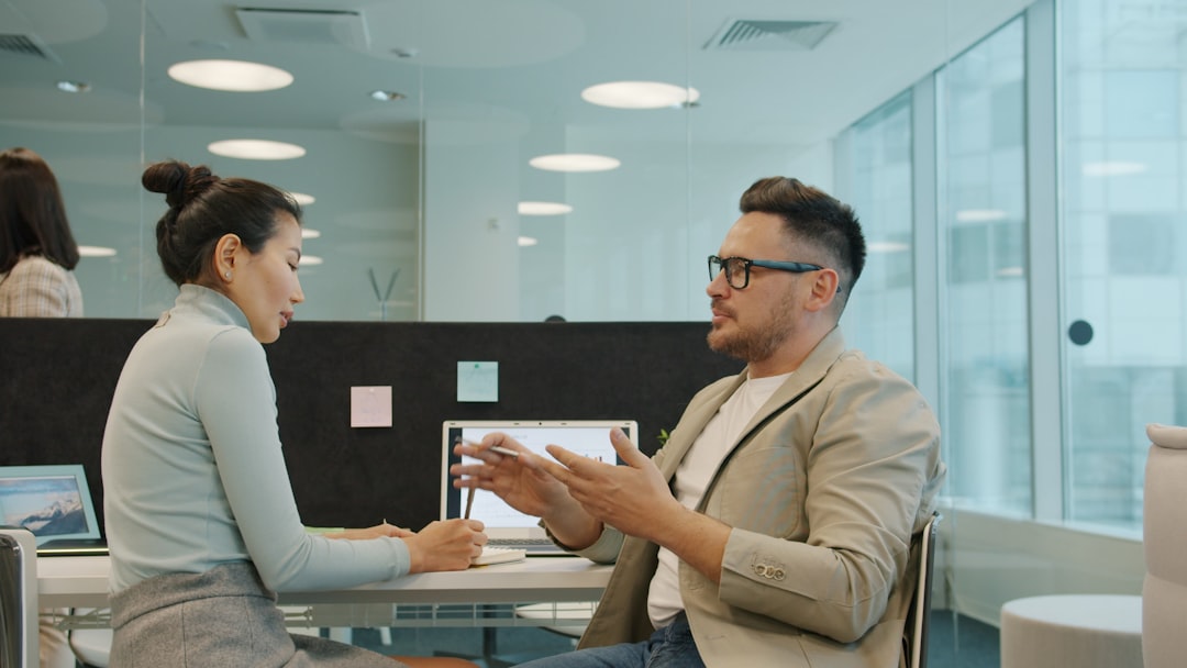 Business professional meeting with loan officer reviewing documents