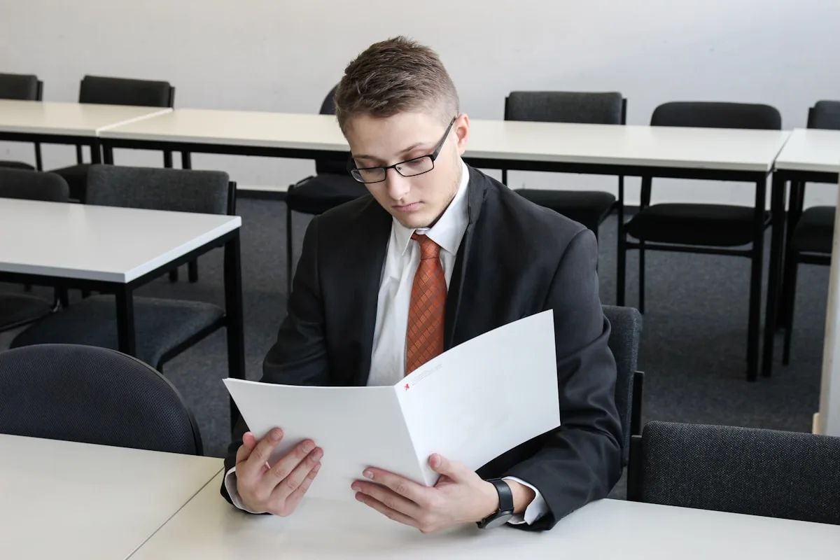 Business professional reviewing franchise contract with concern