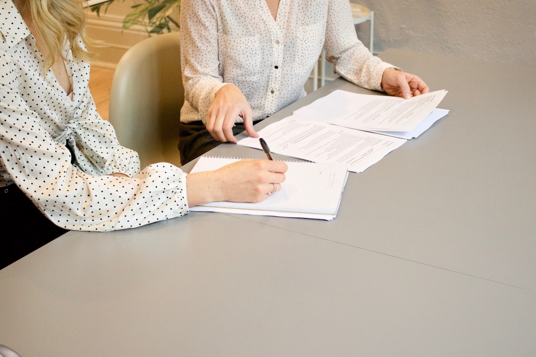 Franchise investor reviewing loan documents with an SBA lender